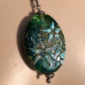 Glass pendant on crystal beaded necklace